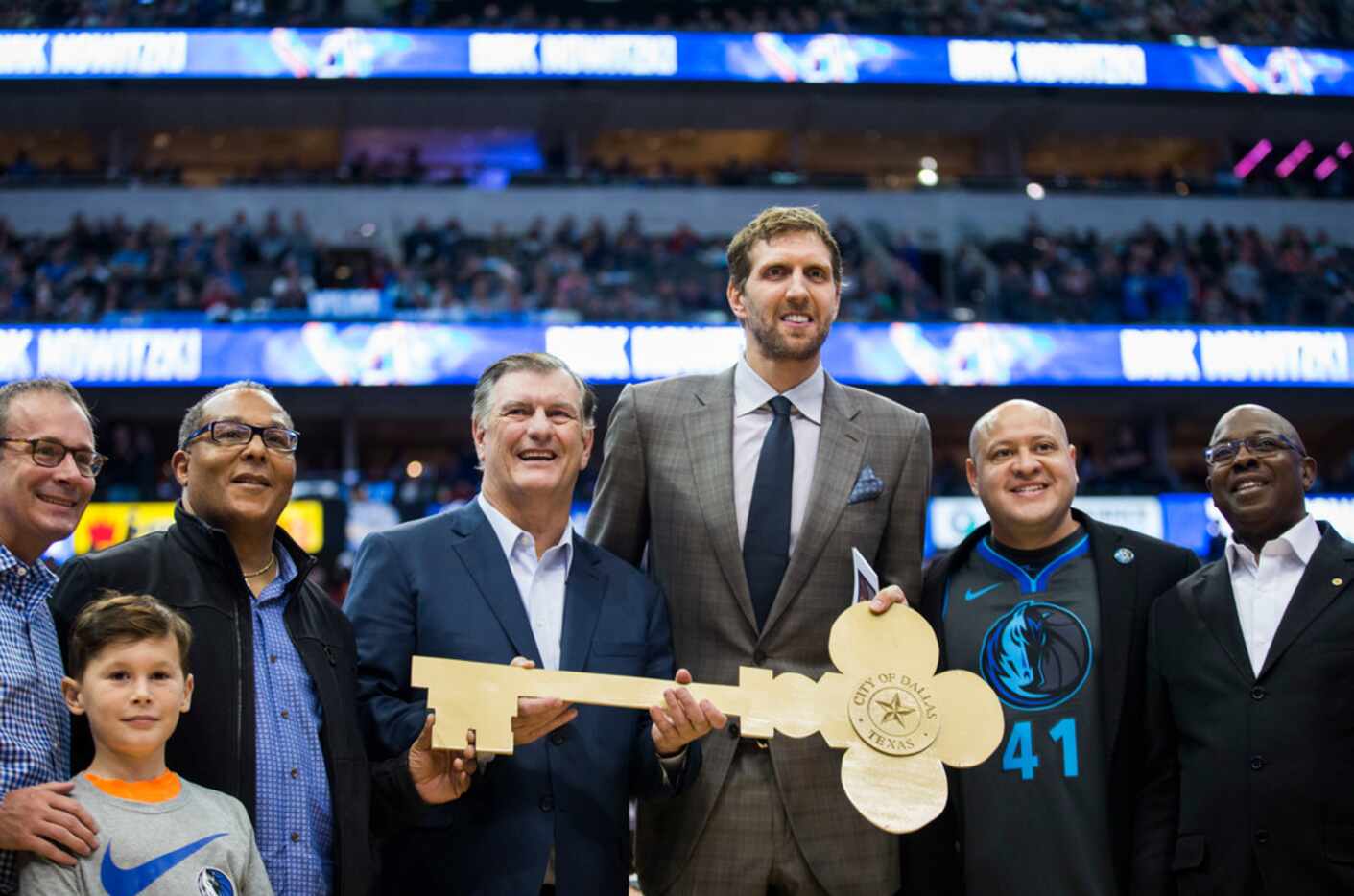 Mayor Mike Rawlings and members of Dallas City Council -- including, in the Mavs jersey,...