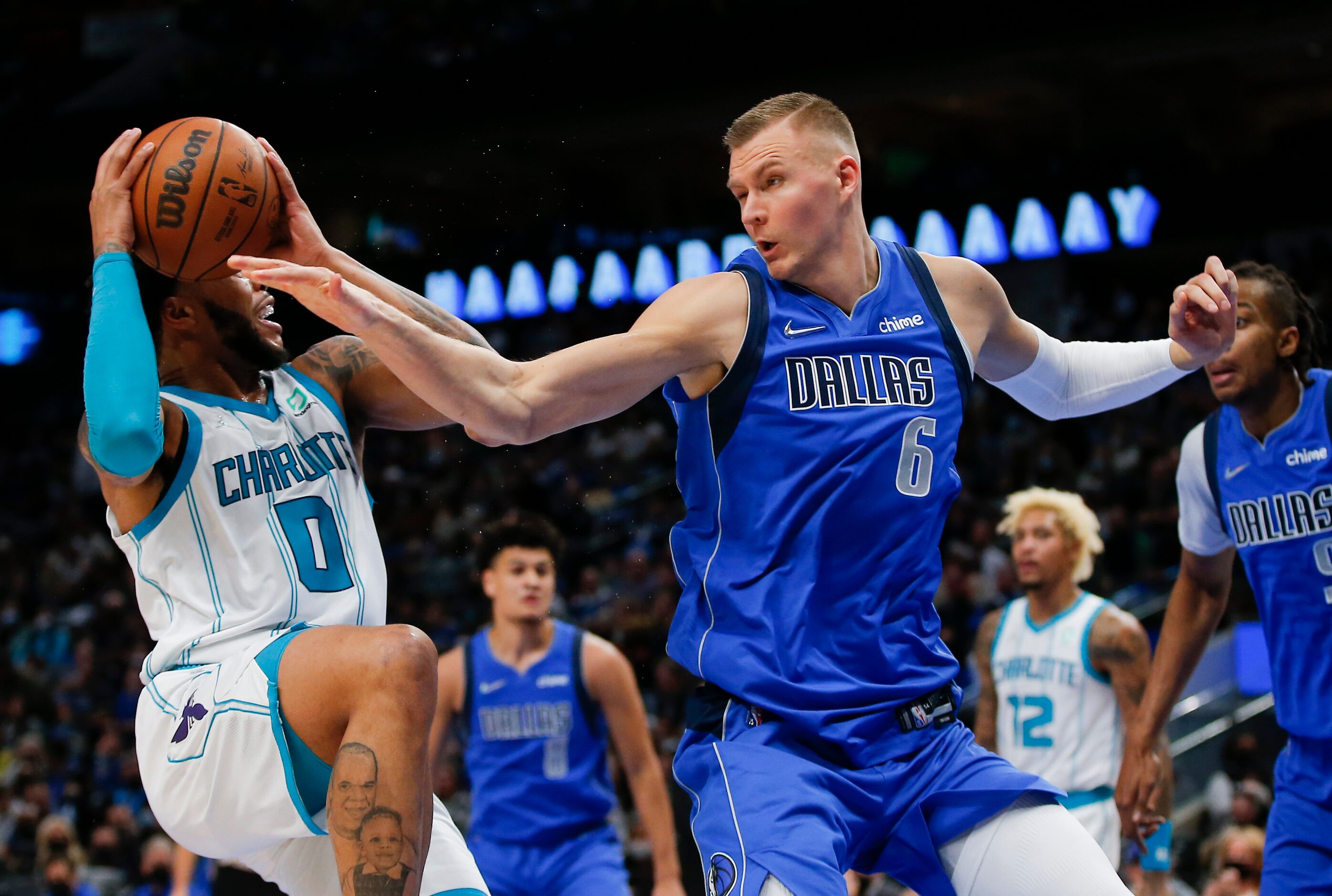 Charlotte Hornets forward Miles Bridges (0) attempts a shot as Dallas Mavericks center...