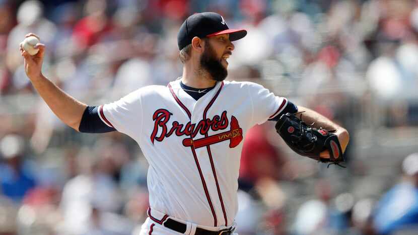 Atlanta Braves relief pitcher Chris Martin (51) works in the eighth inning of a baseball...