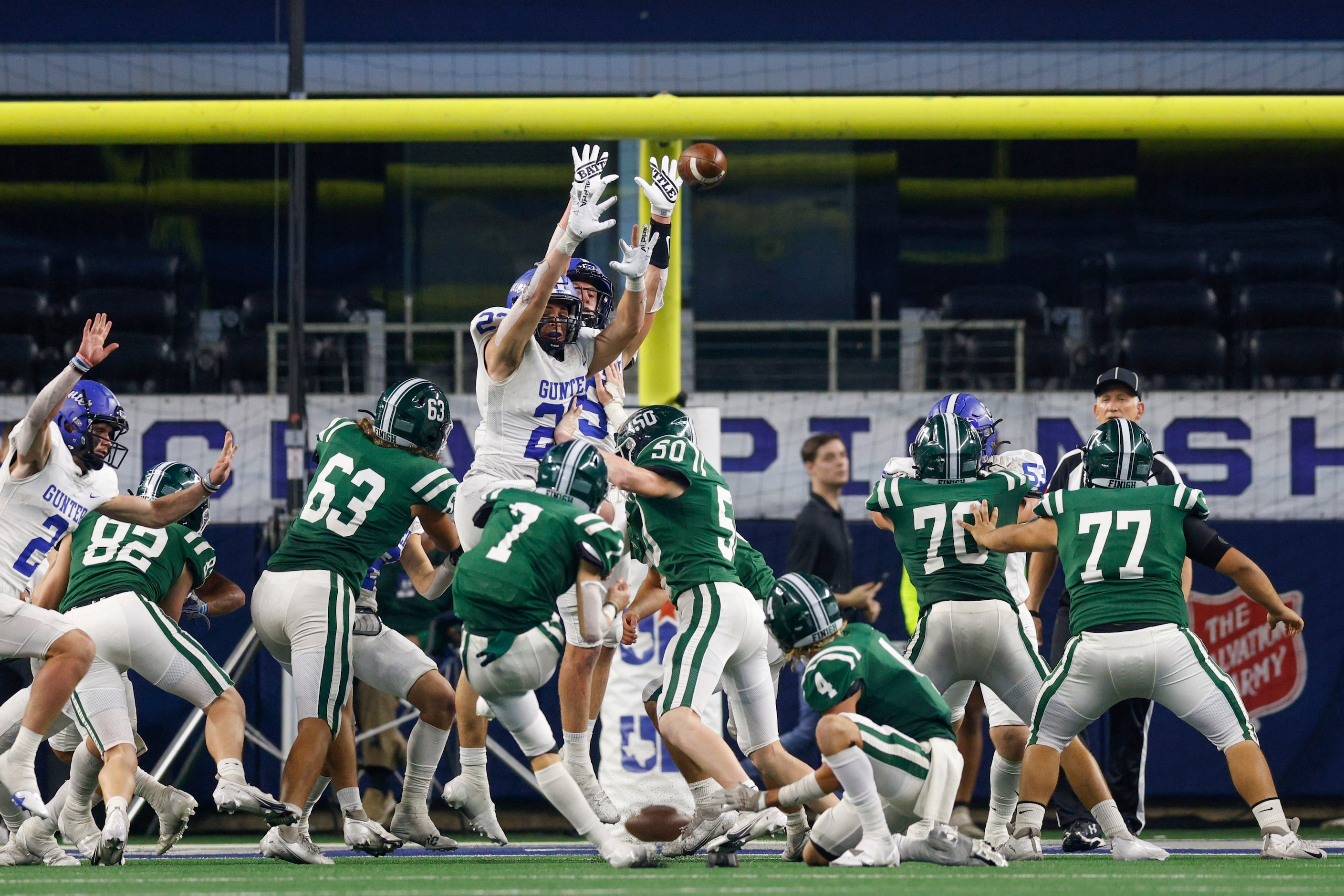 Gunter linebacker Erik Tapia (22) and Gunter defensive back Cole Lemons (9) attempt to block...