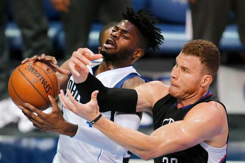 Dallas Mavericks forward Nerlens Noel (3) and LA Clippers forward Blake Griffin (32) battle...