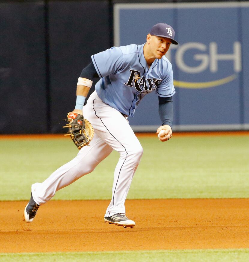 ST. PETERSBURG, FL - OCTOBER 1: Trevor Plouffe #14 of the Tampa Bay Rays looks to throw...