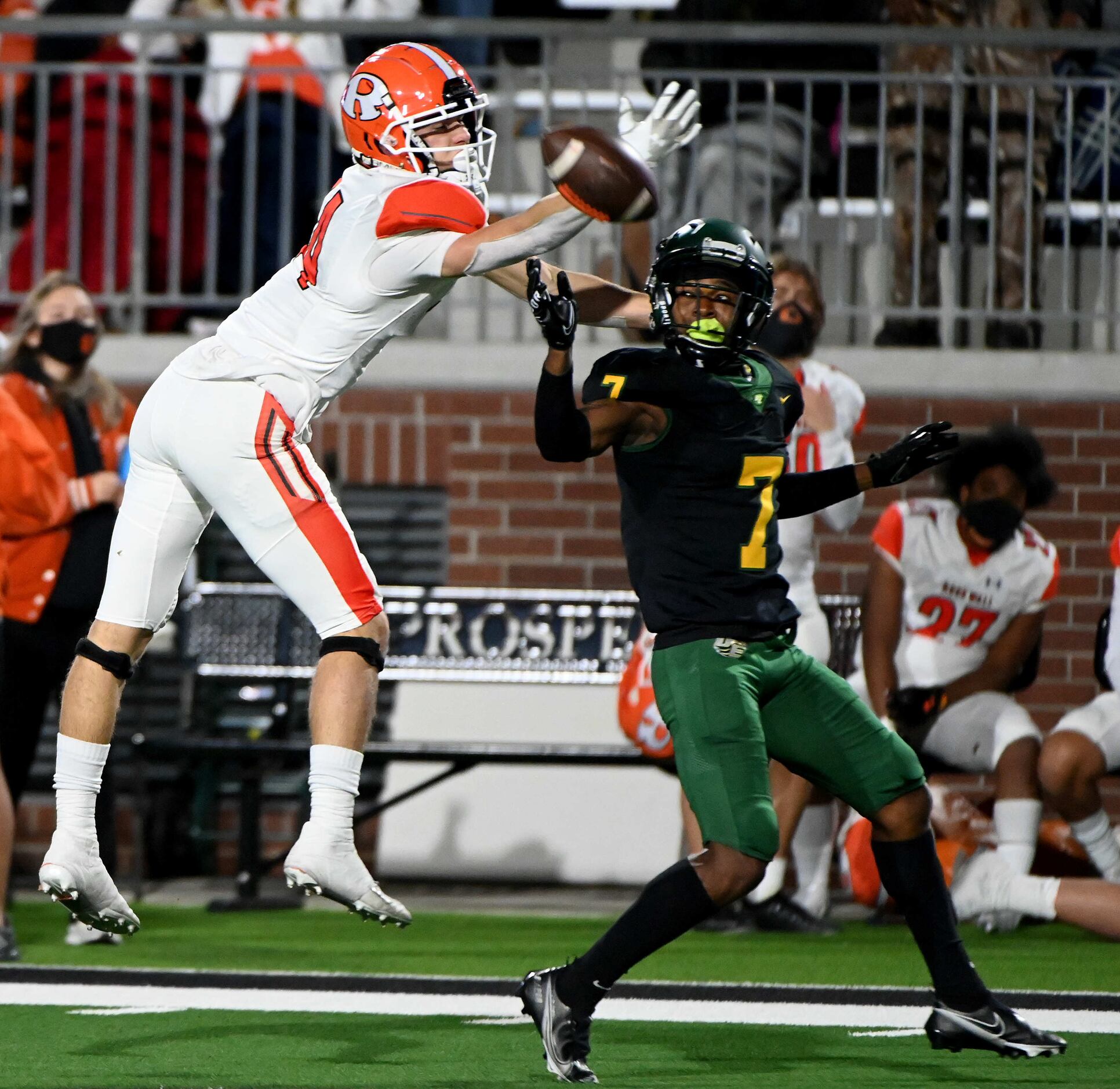 Rockwall’s Caden Marshall (14) can’t make the catch while defended by DeSoto’s Lathan Adams...