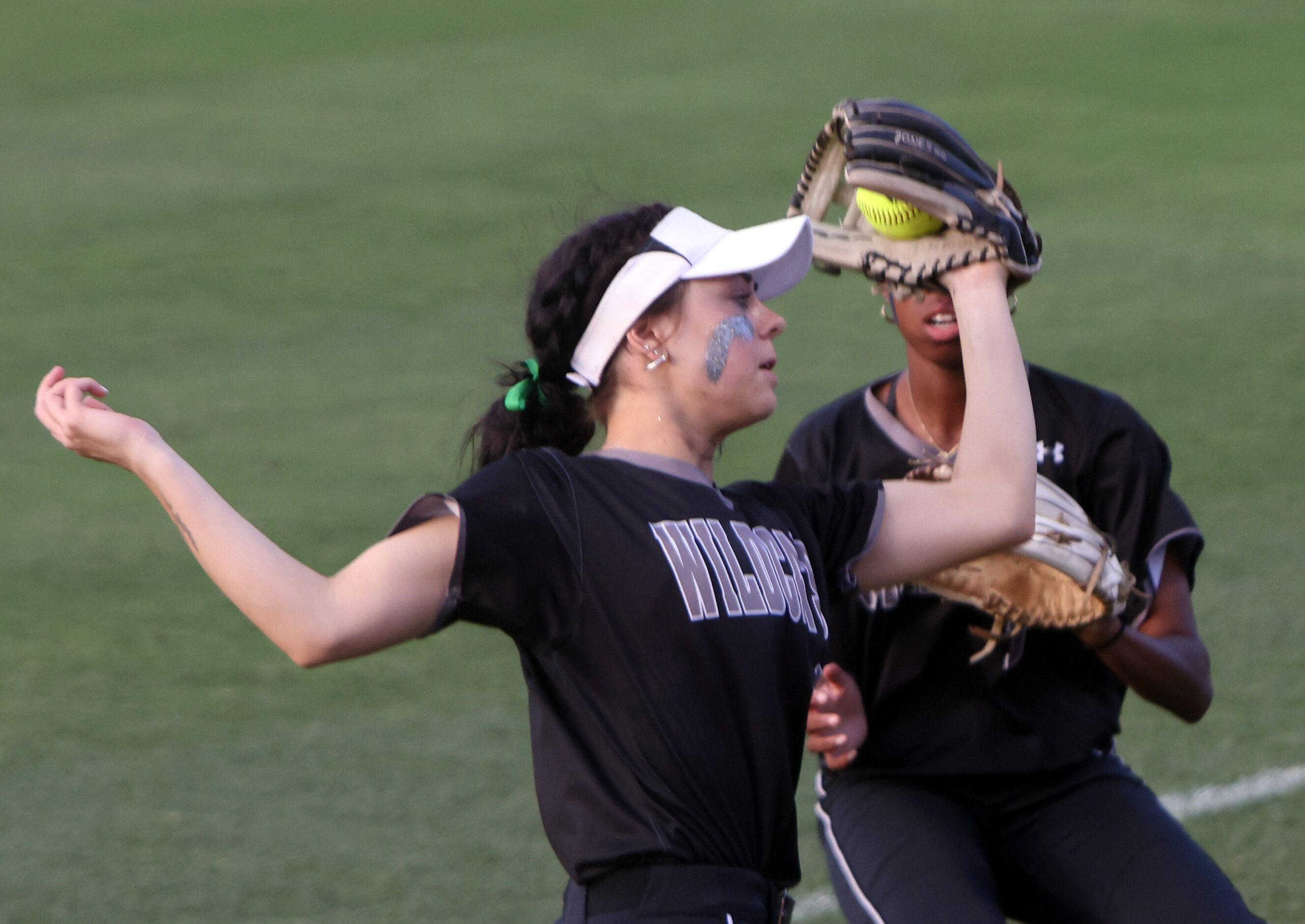 Denton Guyer 2d baseman Kaylynn Jones (6) pulls in a fly ball  in front of right fielder...