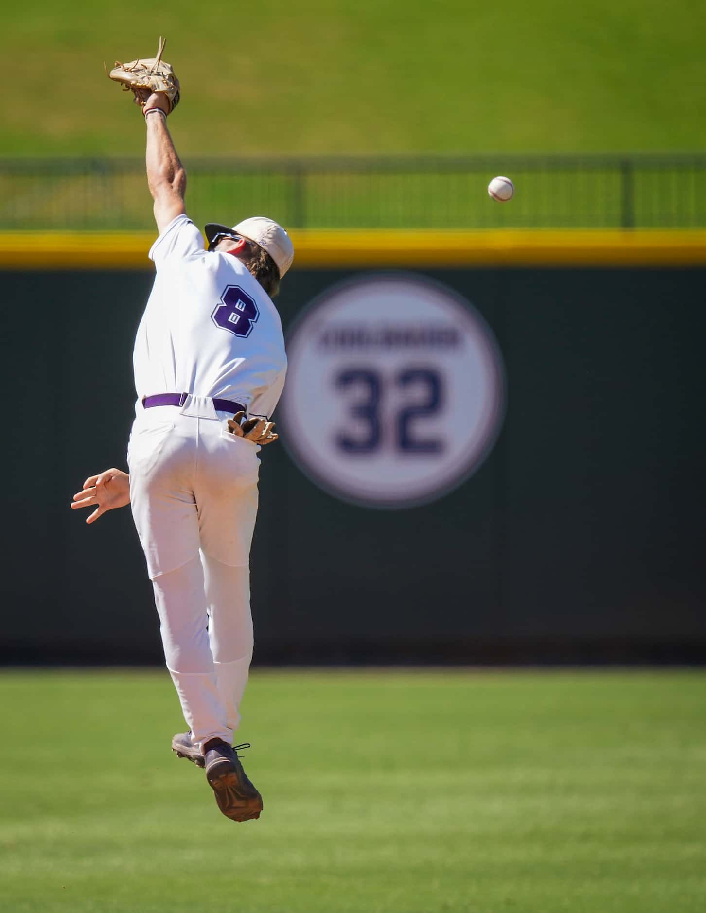 Fort Bend Ridge Point shortstop Justin Vossos can’t make a leaping play on a single by...