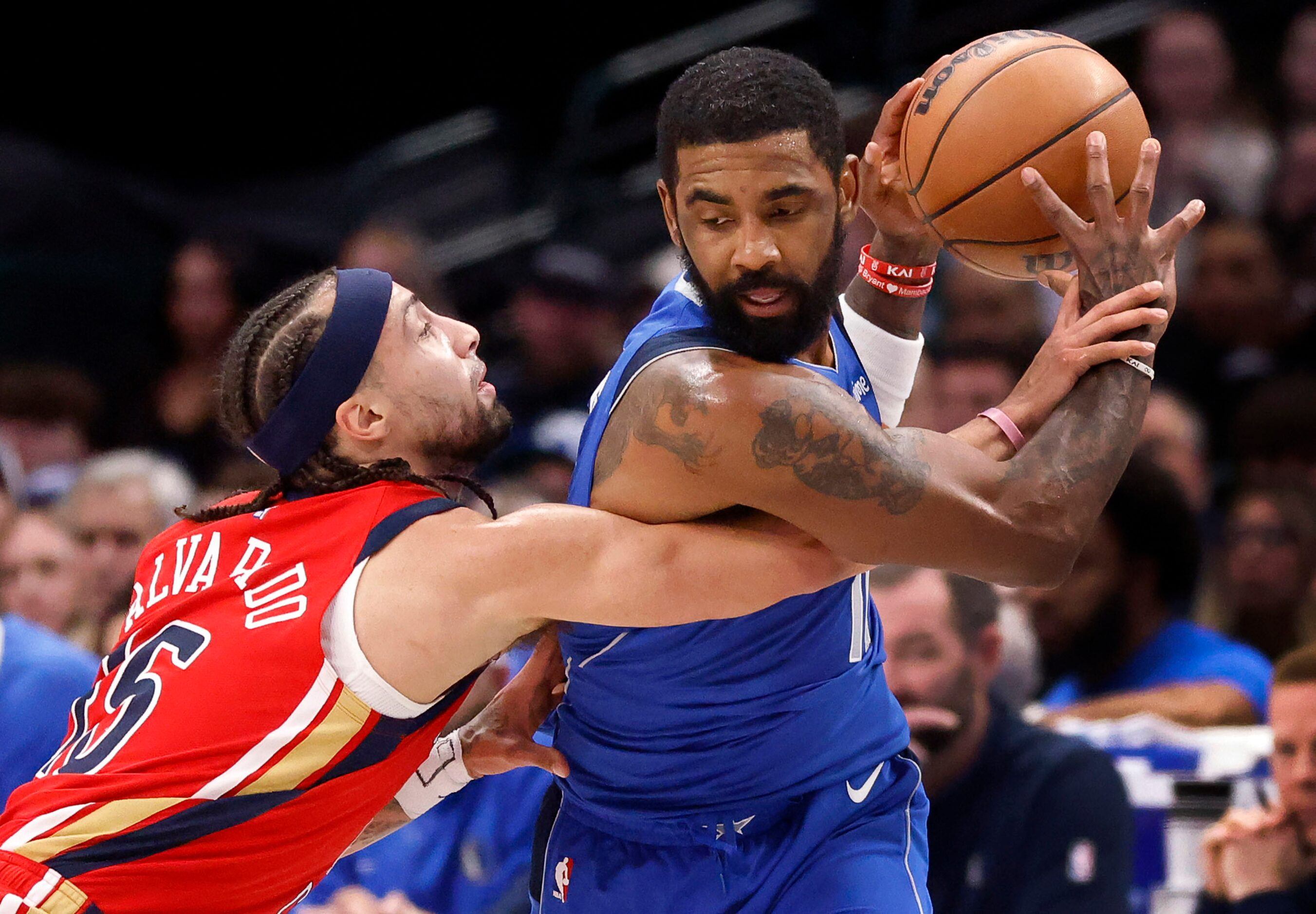 New Orleans Pelicans guard Jose Alvarado (15) tries to swat the ball from Dallas Mavericks...