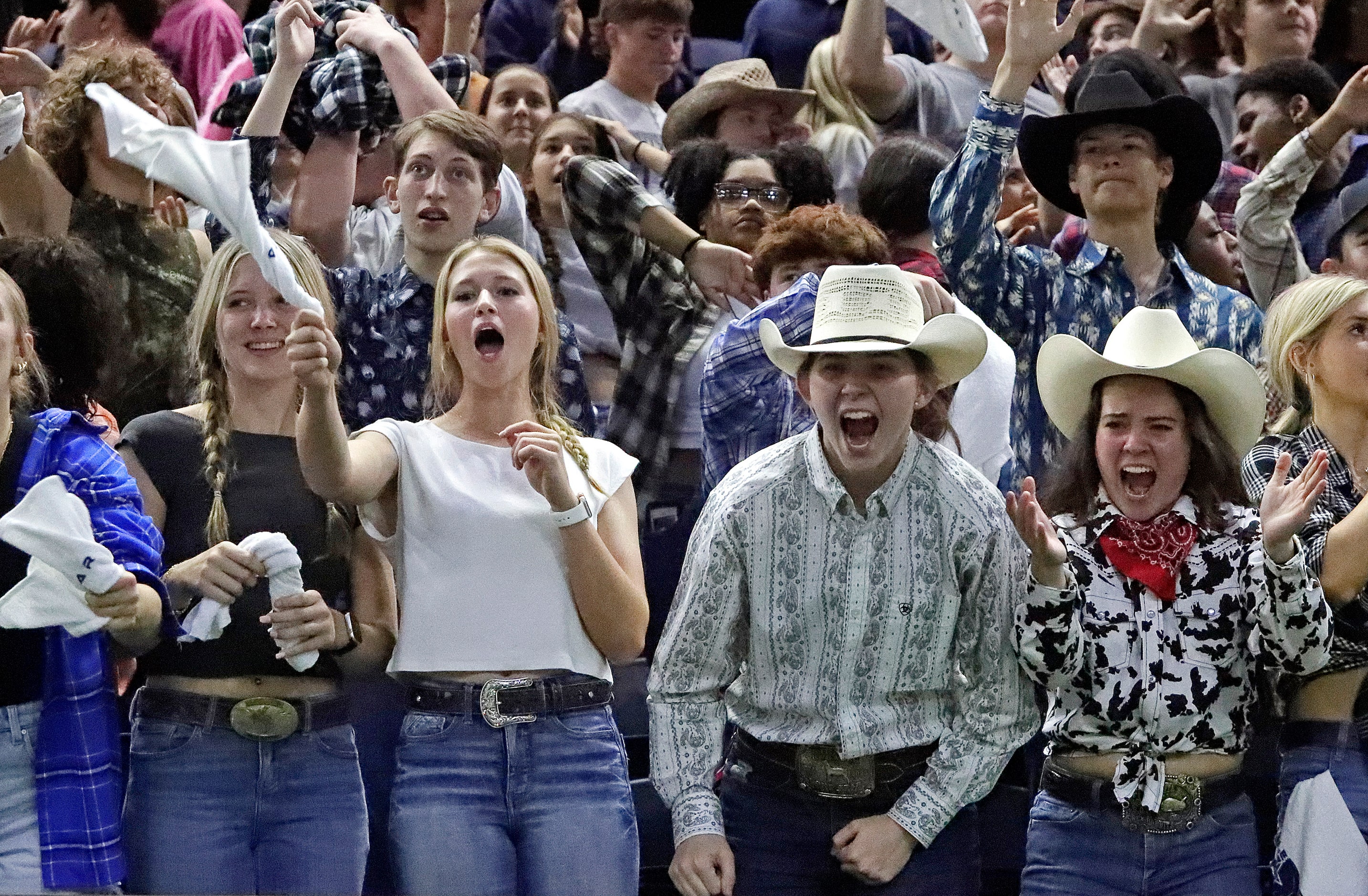 The Lone Star High School student section reacts as time runs out during the second half as...