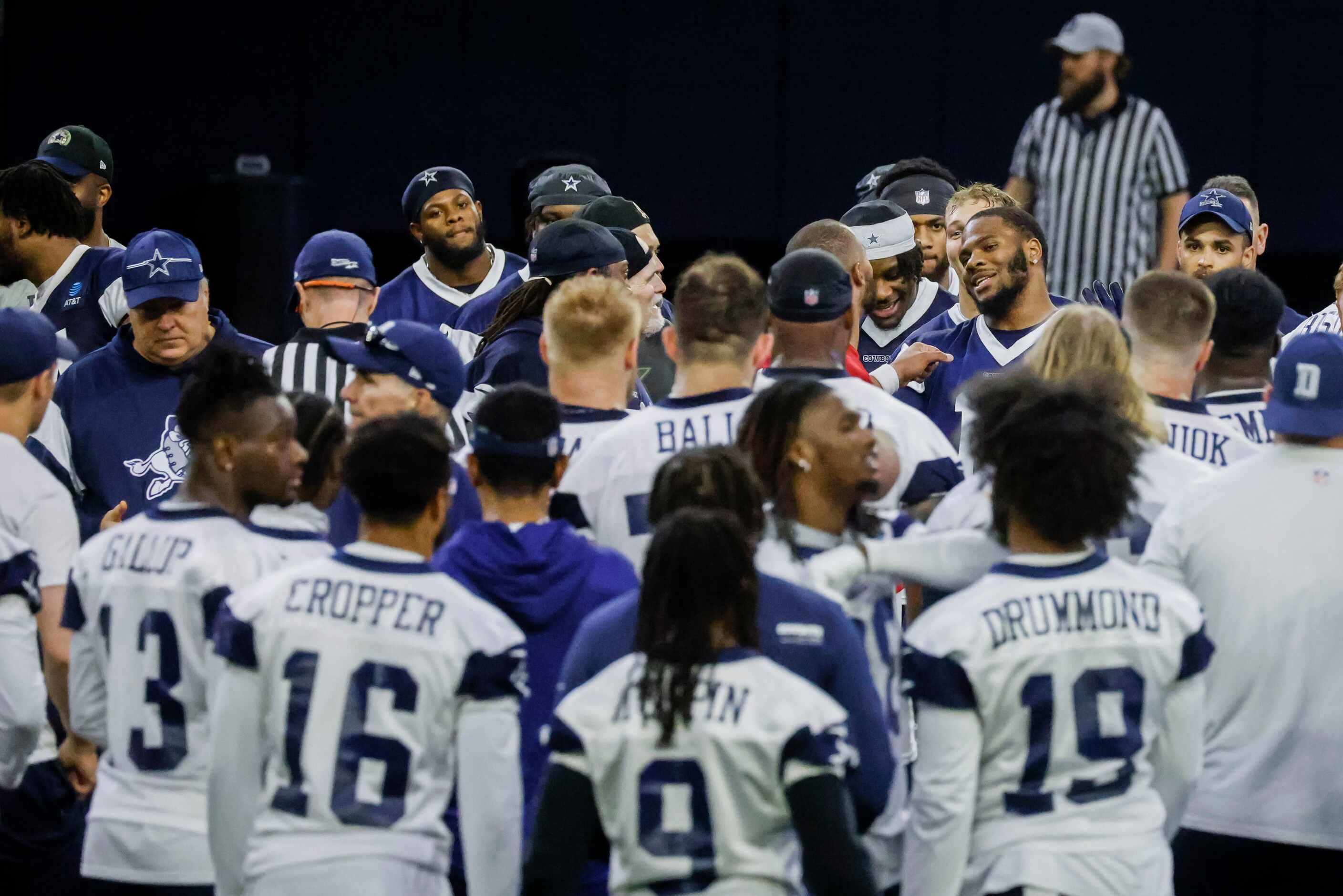 Dallas Cowboys players huddle after OTA practice on Thursday, May 25, 2023 at the Star in...