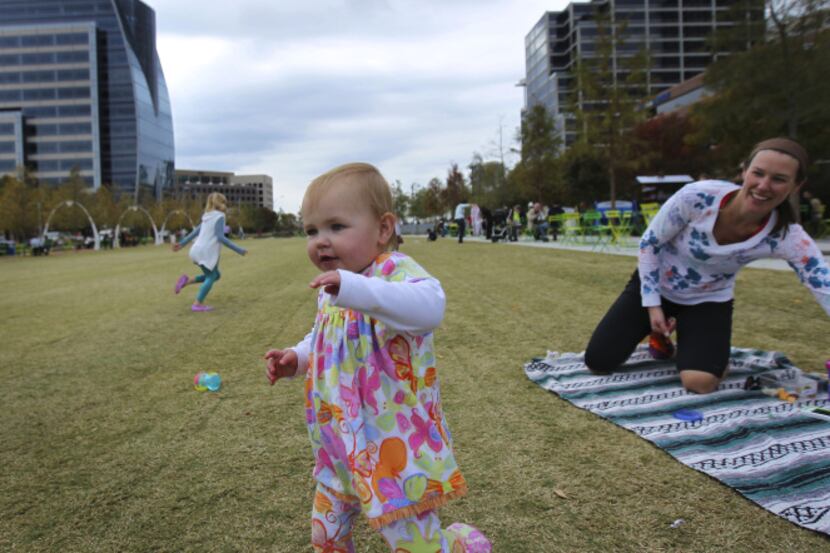 Kate Hanratty (right), and her 15-month-old daughter, Kendall, relaxed in Klyde Warren Park...