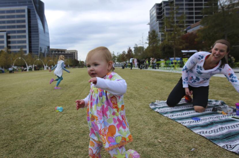 Kate Hanratty (right), and her 15-month-old daughter, Kendall, relaxed in Klyde Warren Park...