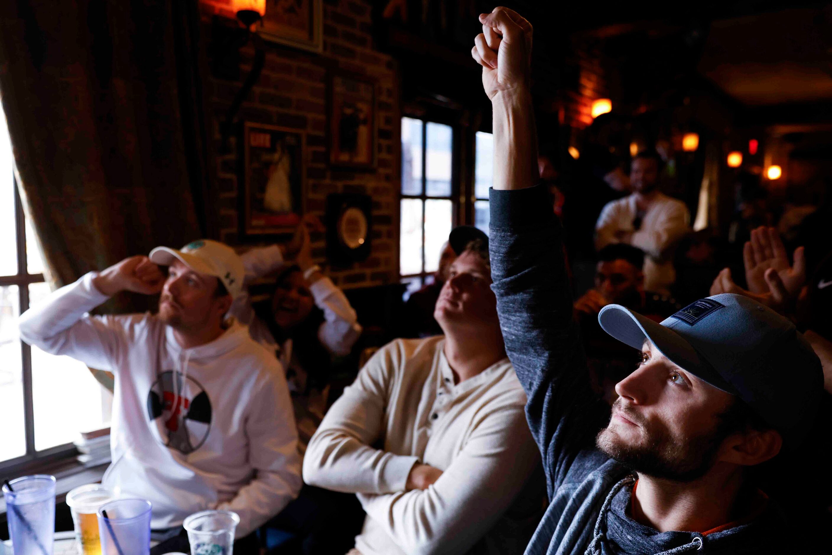 Trevis barber, of Dallas, raises his hand as he reacts during the last minute of a soccer...