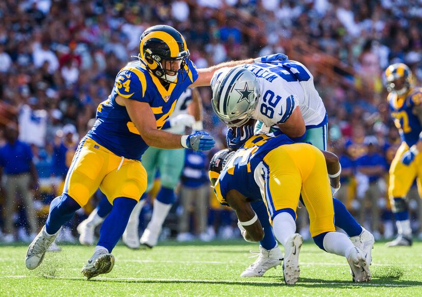 Dallas Cowboys tight end Jason Witten (82) is tackled by Los Angeles Rams defensive back...