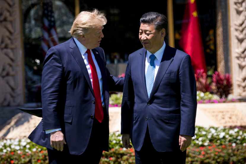 FILE -- President Donald Trump with President Xi Jinping of China in Palm Beach, Fla.,...
