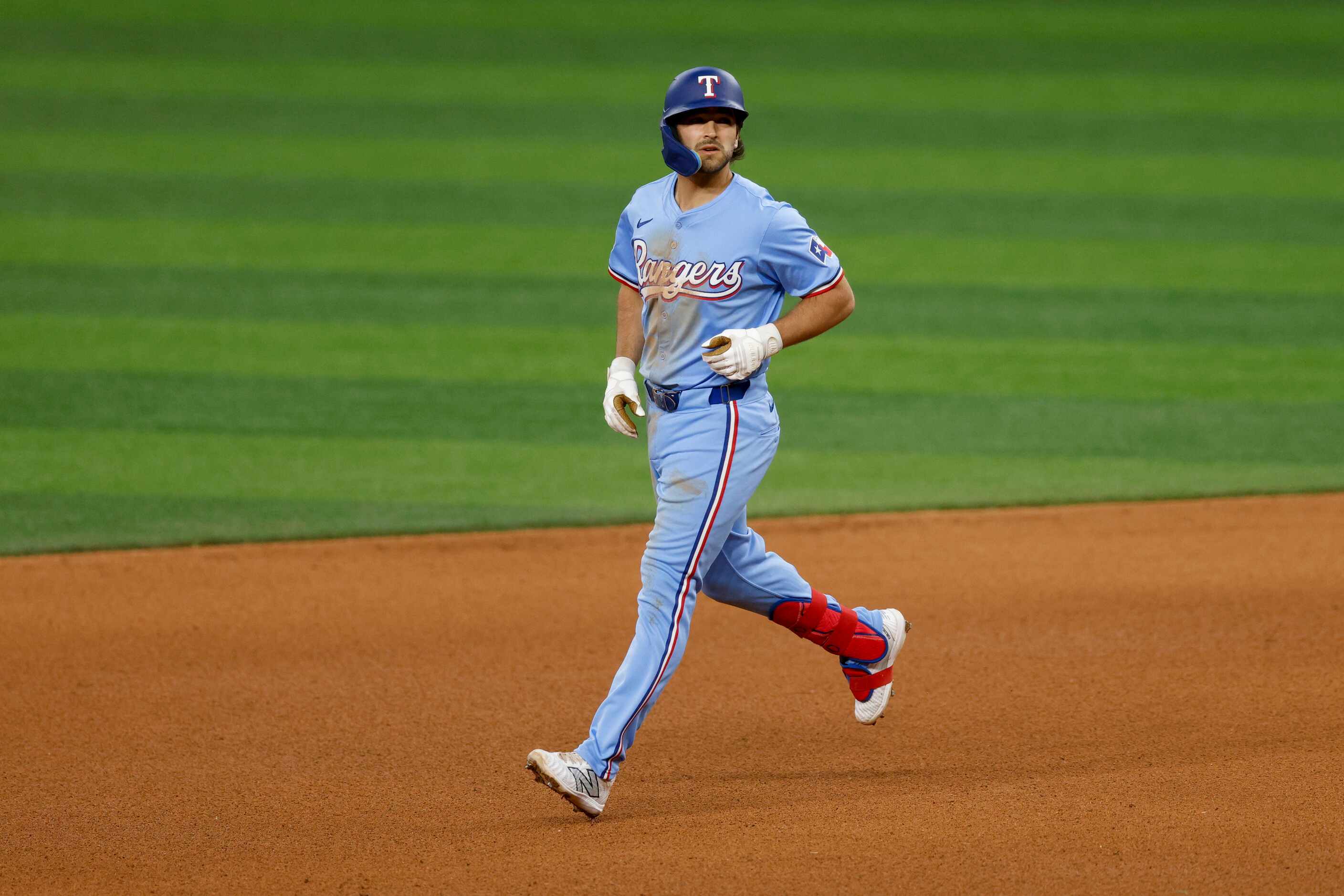 Texas Rangers third baseman Josh Smith (8) rounds the bases after flying out to left during...