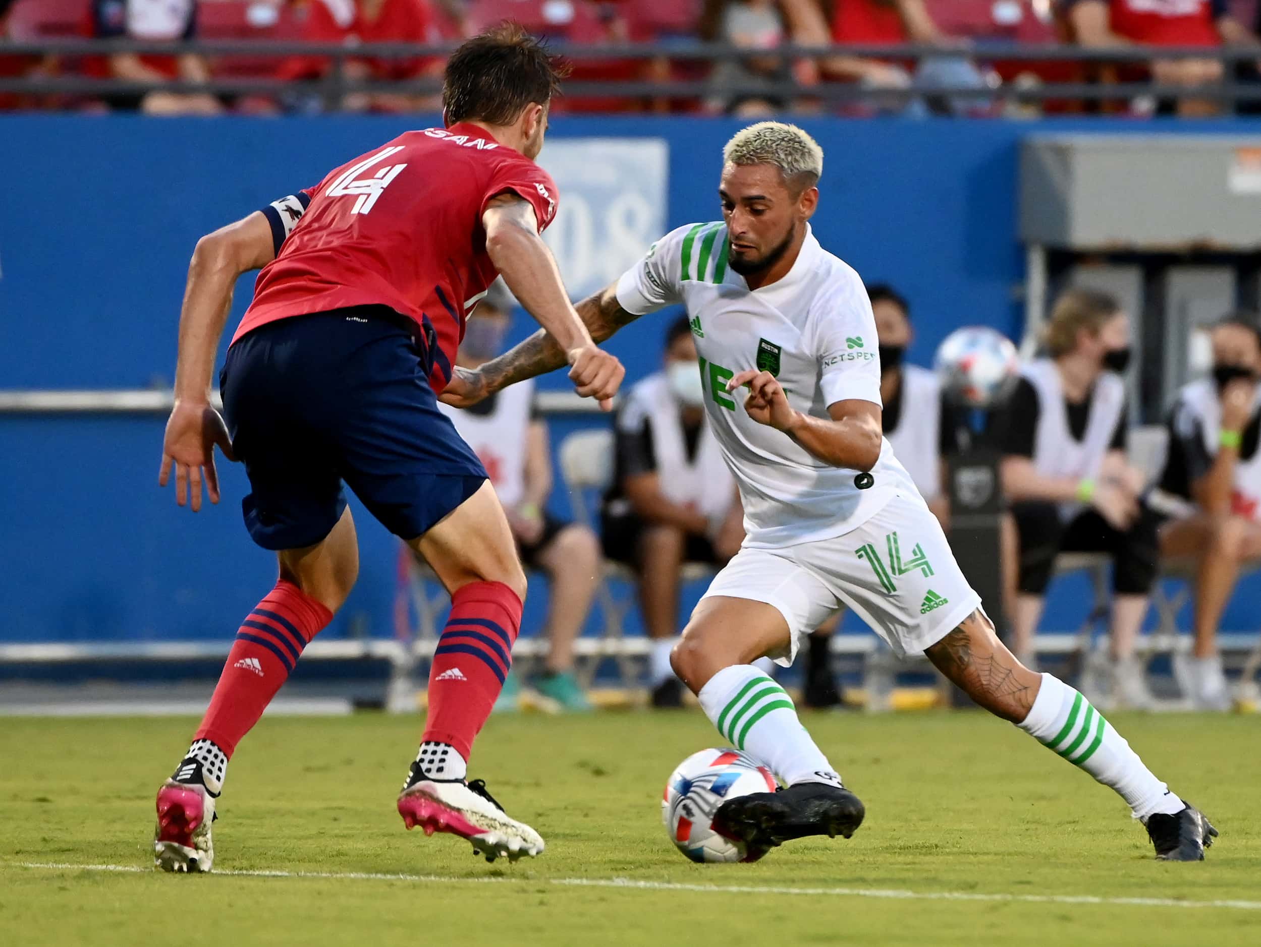 FC Dallas defender Bressan (4) defends on Austin FC forward Diego Fagundez (14) in the first...