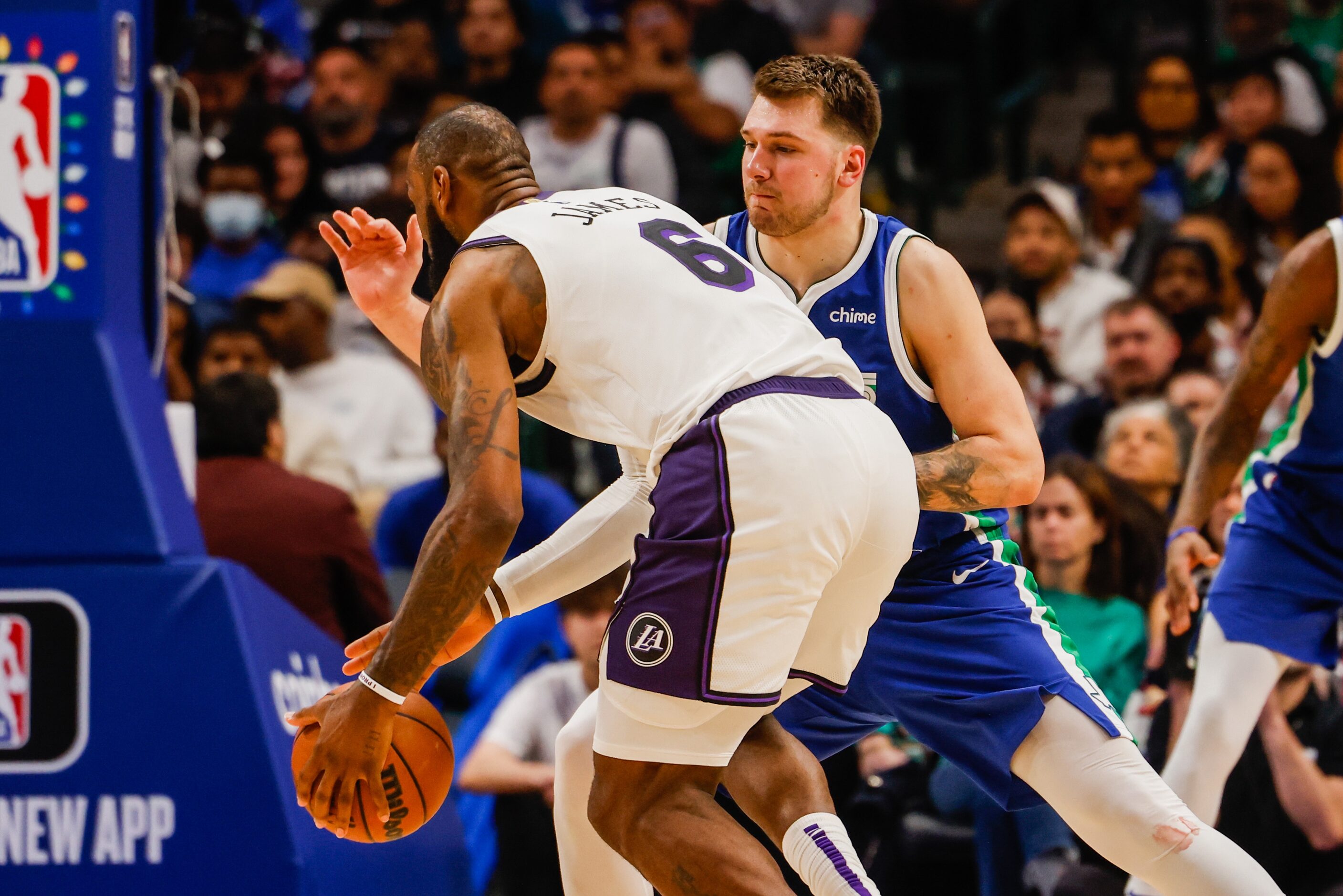 Los Angeles Lakers forward LeBron James (6) goes around Dallas Mavericks guard Luka Doncic...