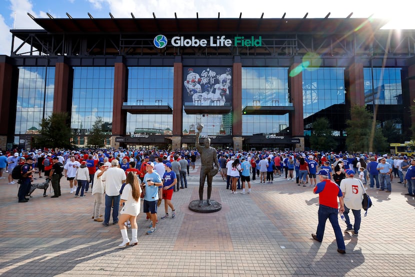 Texas Rangers fans file into Globe Life Field in Arlington before Game 1 of the World Series...