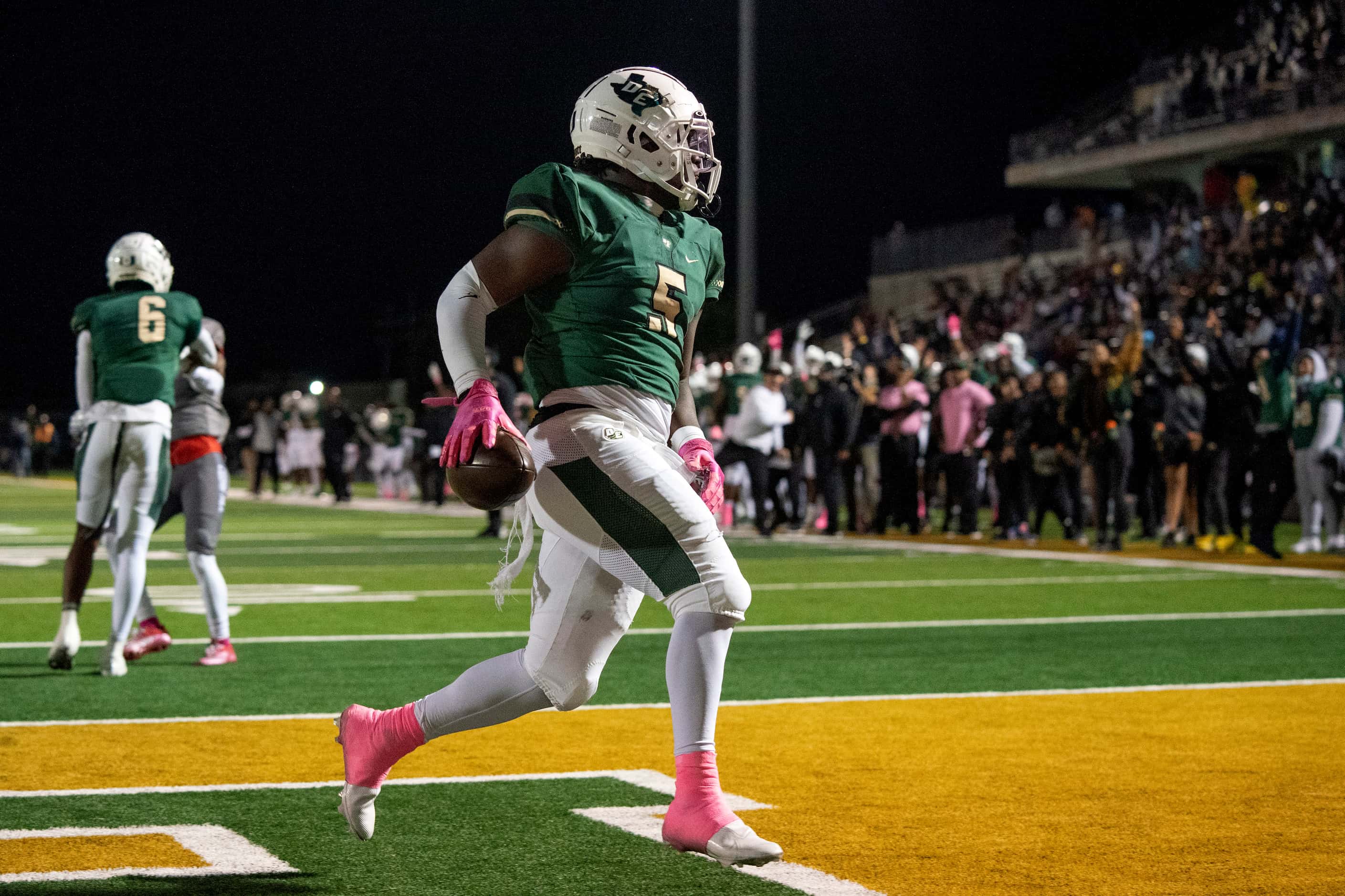 DeSoto senior running back Christopher Henley II (5) runs in for the first touchdown of the...