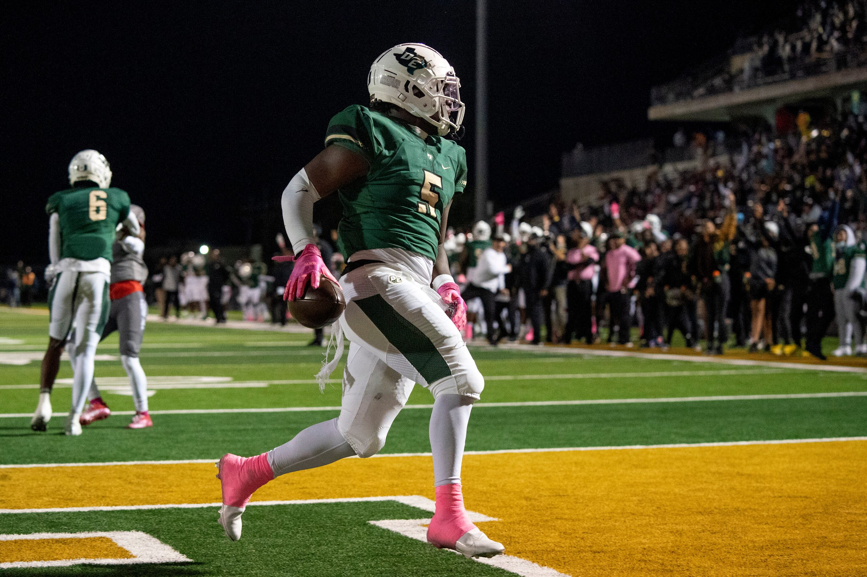 DeSoto senior running back Christopher Henley II (5) runs in for the first touchdown of the...