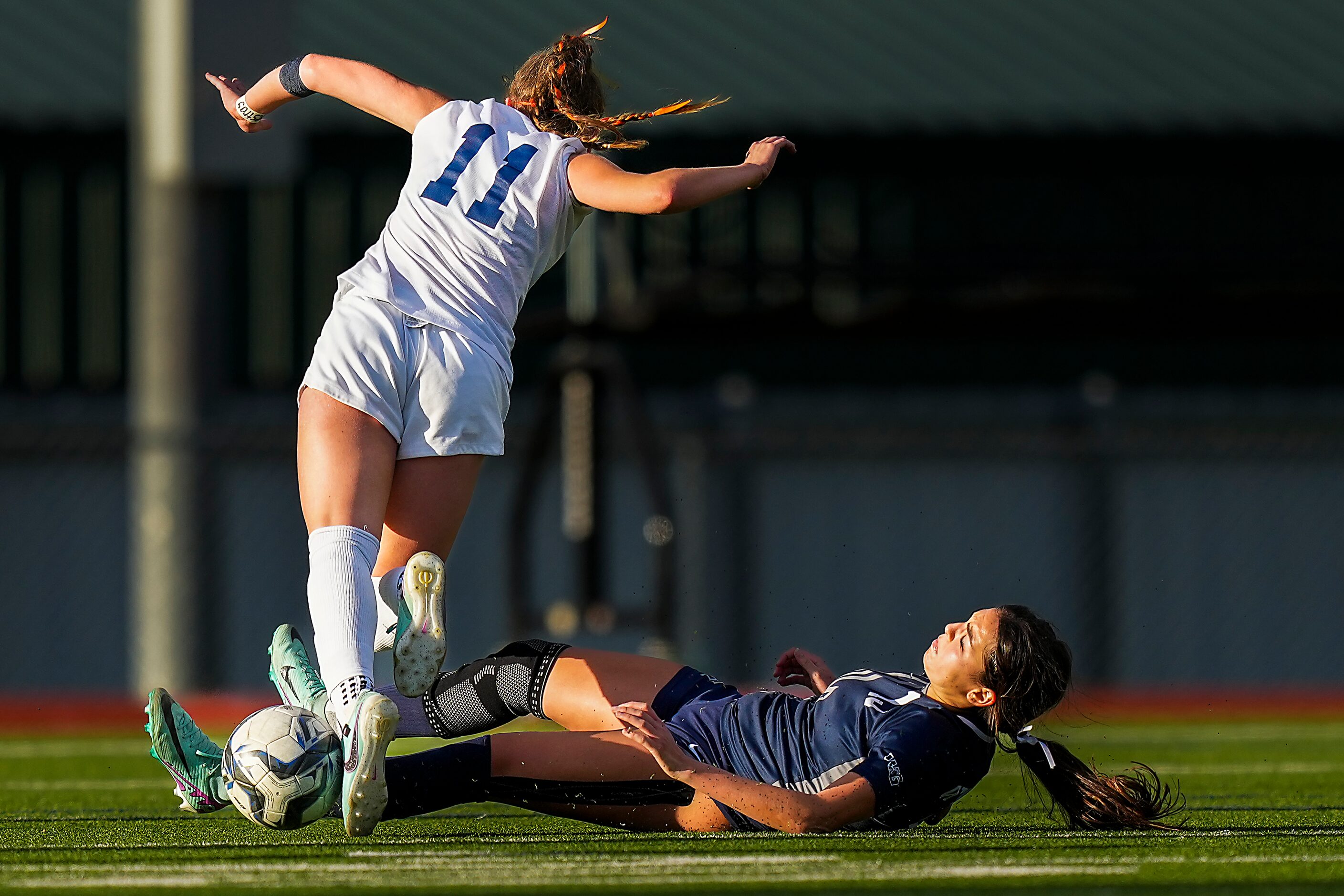 Prosper Walnut Grove midfielder Gianna Wilbur makes a sliding tackle against Frisco...