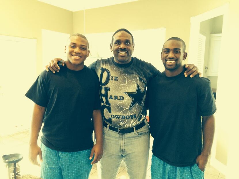 Former Cowboys player Nate Newton with his sons King (left) and Tre'.
