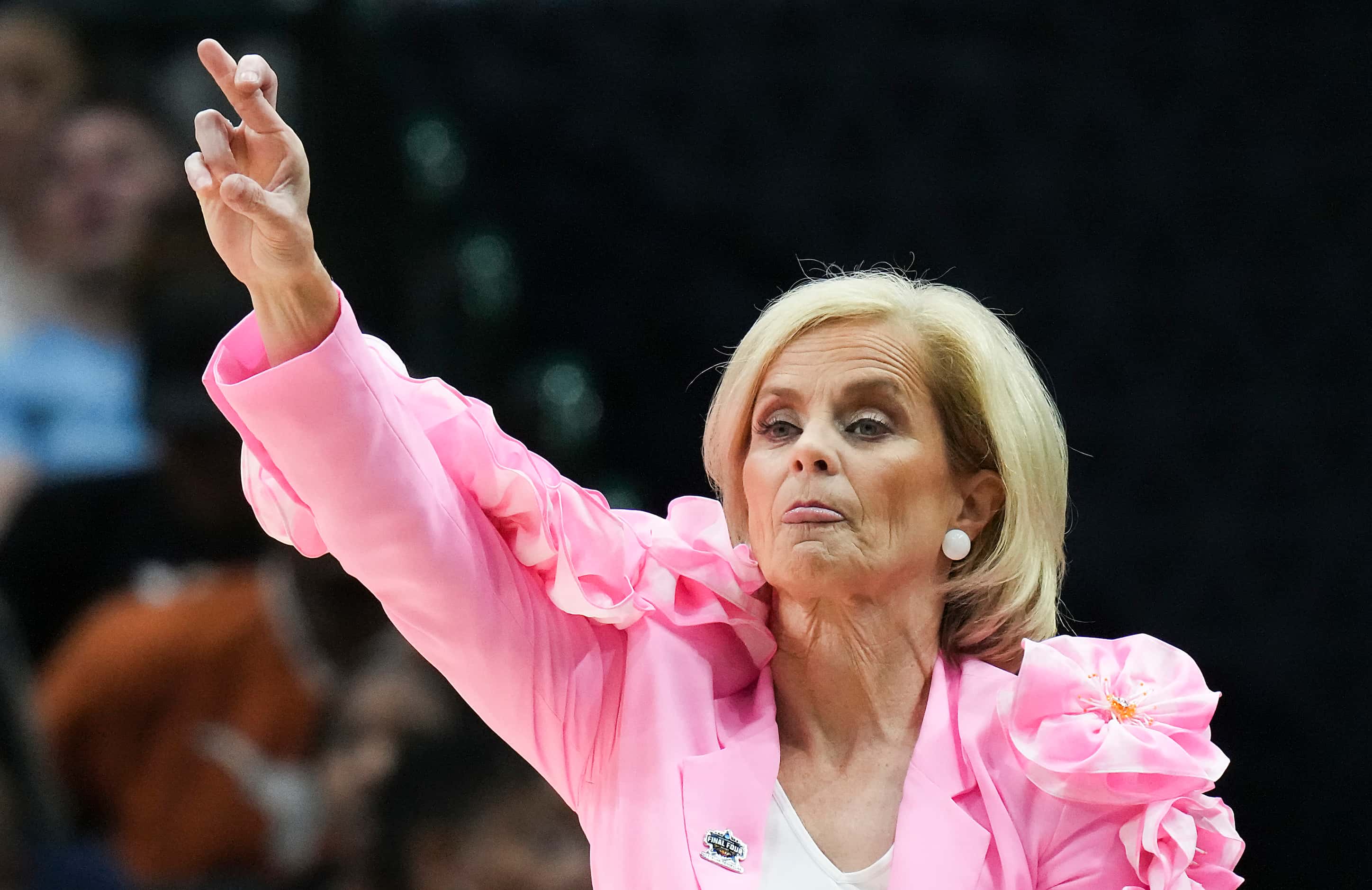 LSU head coach Kim Mulkey motions to her team during the first half of an NCAA Women's Final...