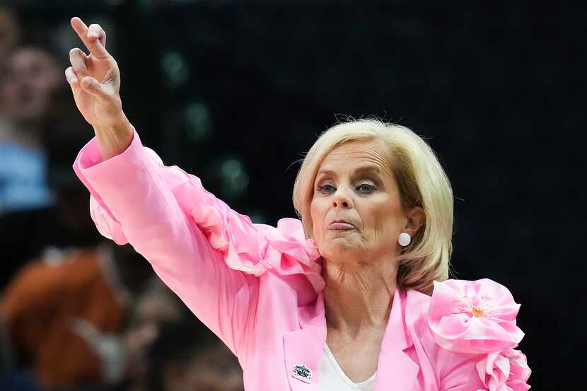 LSU head coach Kim Mulkey motions to her team during the first half of an NCAA Women's Final...