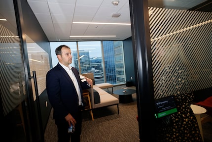 George Popstefanov stands in the doorway of a client screening room.