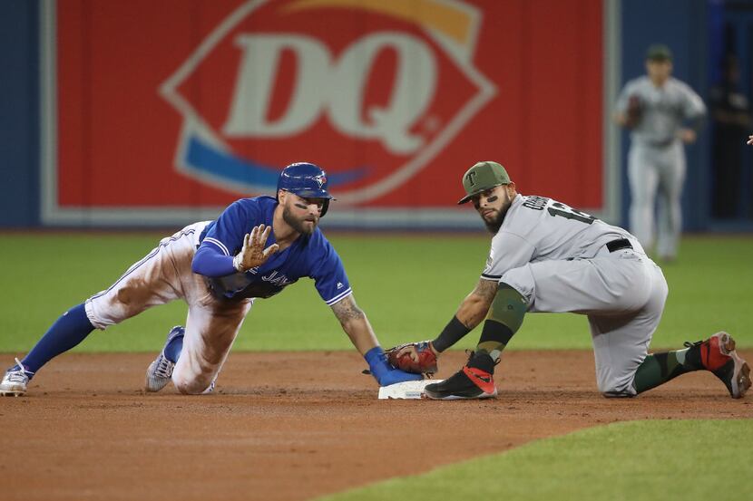 TORONTO, ON - MAY 27: Kevin Pillar #11 of the Toronto Blue Jays steals second base in the...