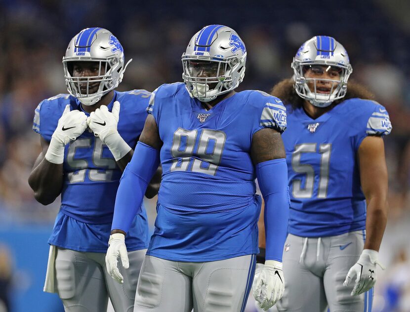 DETROIT, MI - AUGUST 8: Trey Flowers #90, Eric Lee #55 and Jahlani Tavai #51 of the Detroit...