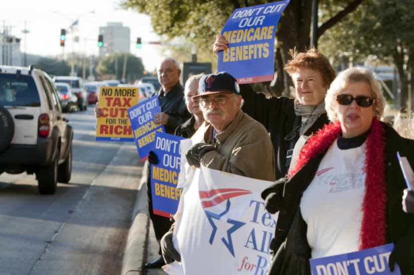 Members of the Texas Alliance for Retired Americans, Texas Progress and MoveOn protested...
