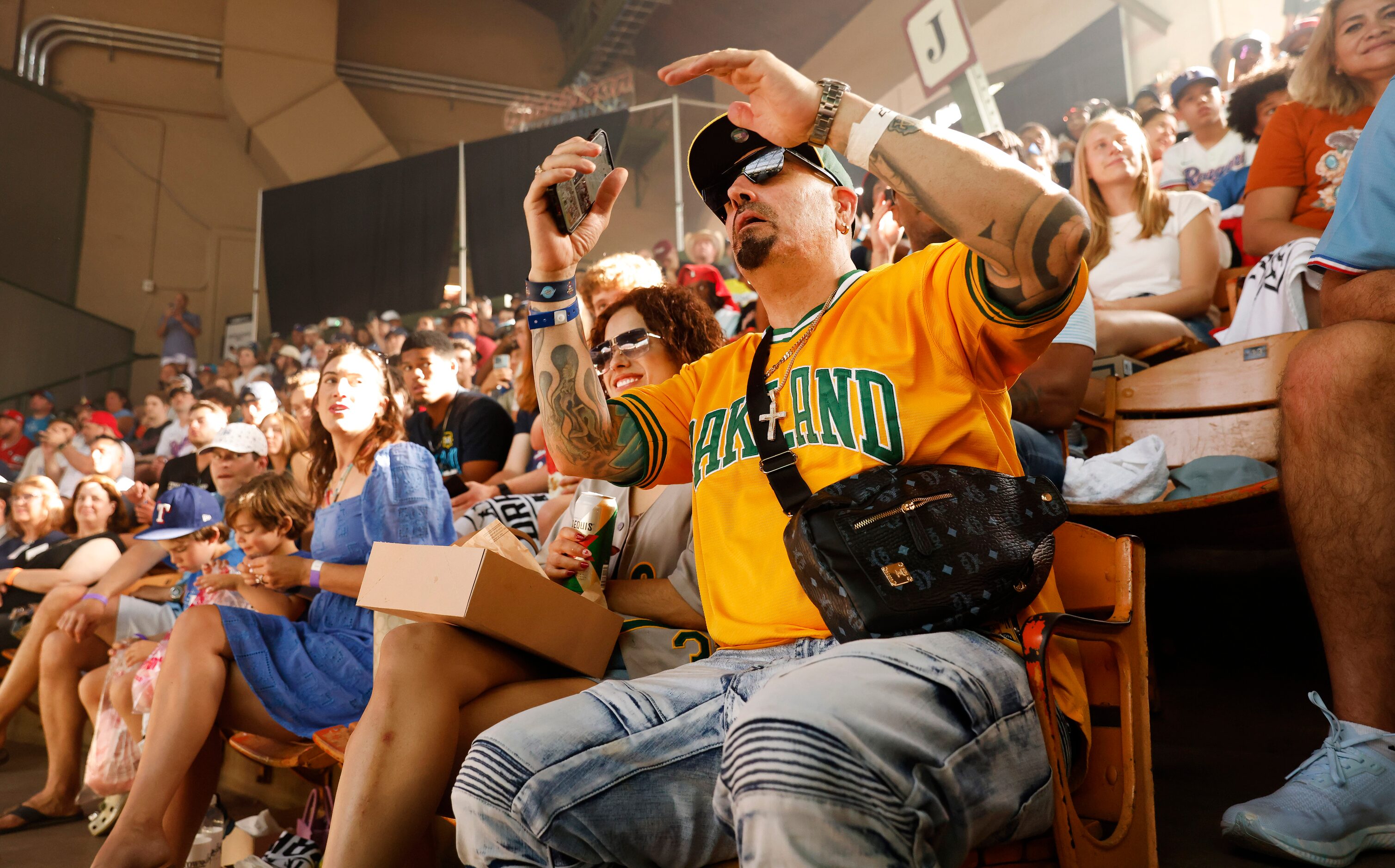 Oakland A’s fan Sam Freund of Fort Worth reacts to the fourth pick during Day 1 of the MLB...