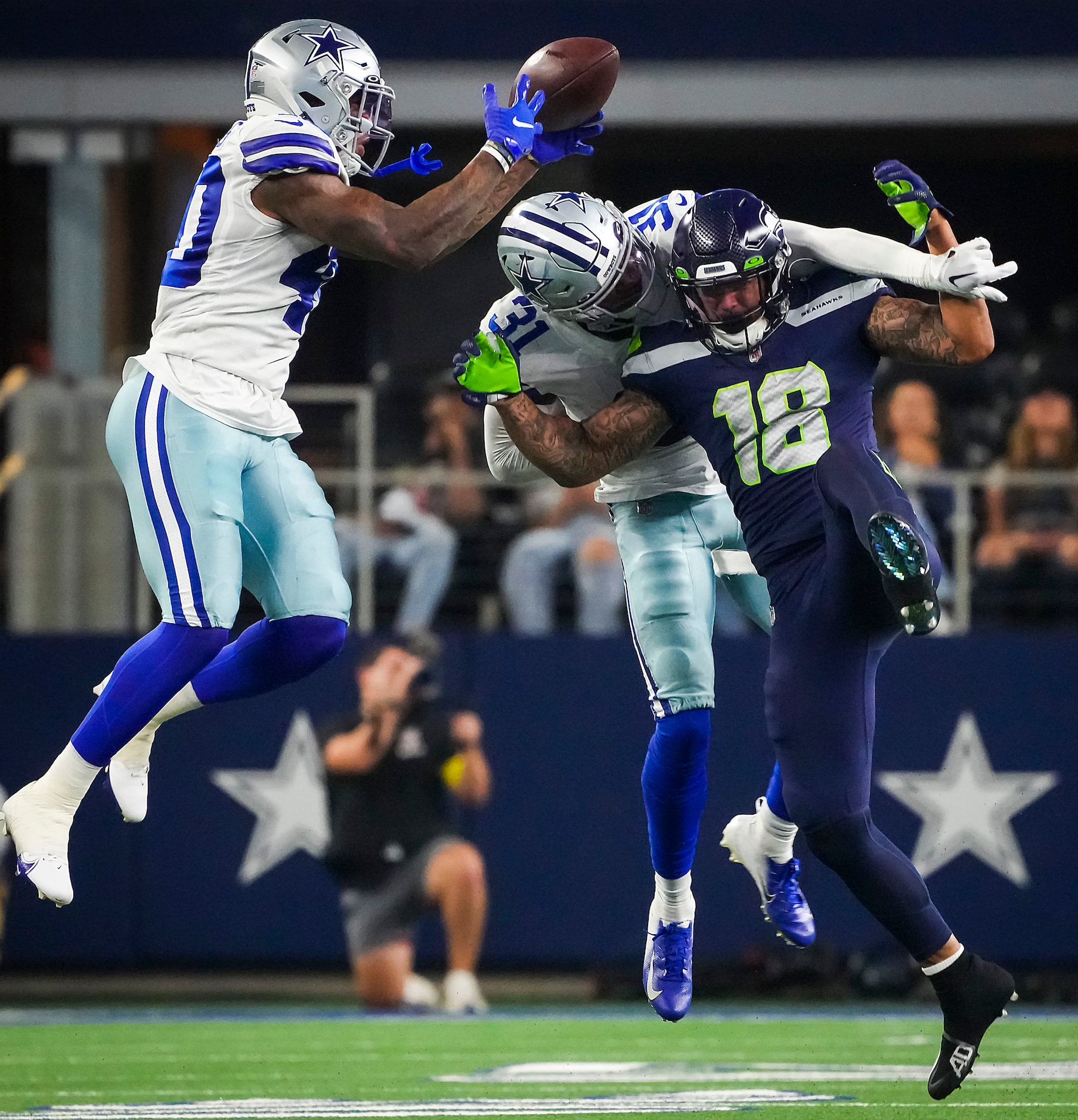 Dallas Cowboys safetys Tyler Coyle (31) and Juanyeh Thomas (40) break up a pass intended for...