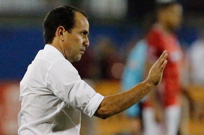 FC Dallas head coach Oscar Pareja gives placement instruction to his team during the second...