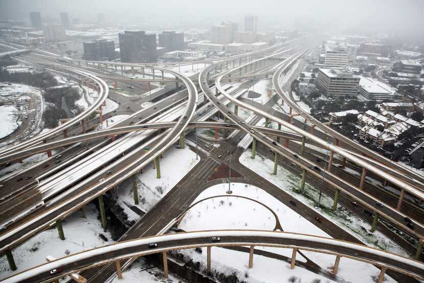Snow covers the area around the High Five Interchange.