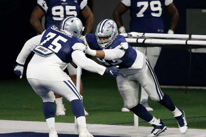Dallas Cowboys defensive tackle Gerald McCoy (93) runs through a drill with Dallas Cowboys...
