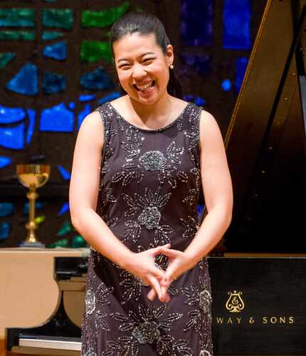 Van Cliburn International Piano Competition silver medalist Joyce Yang acknowledges applause...