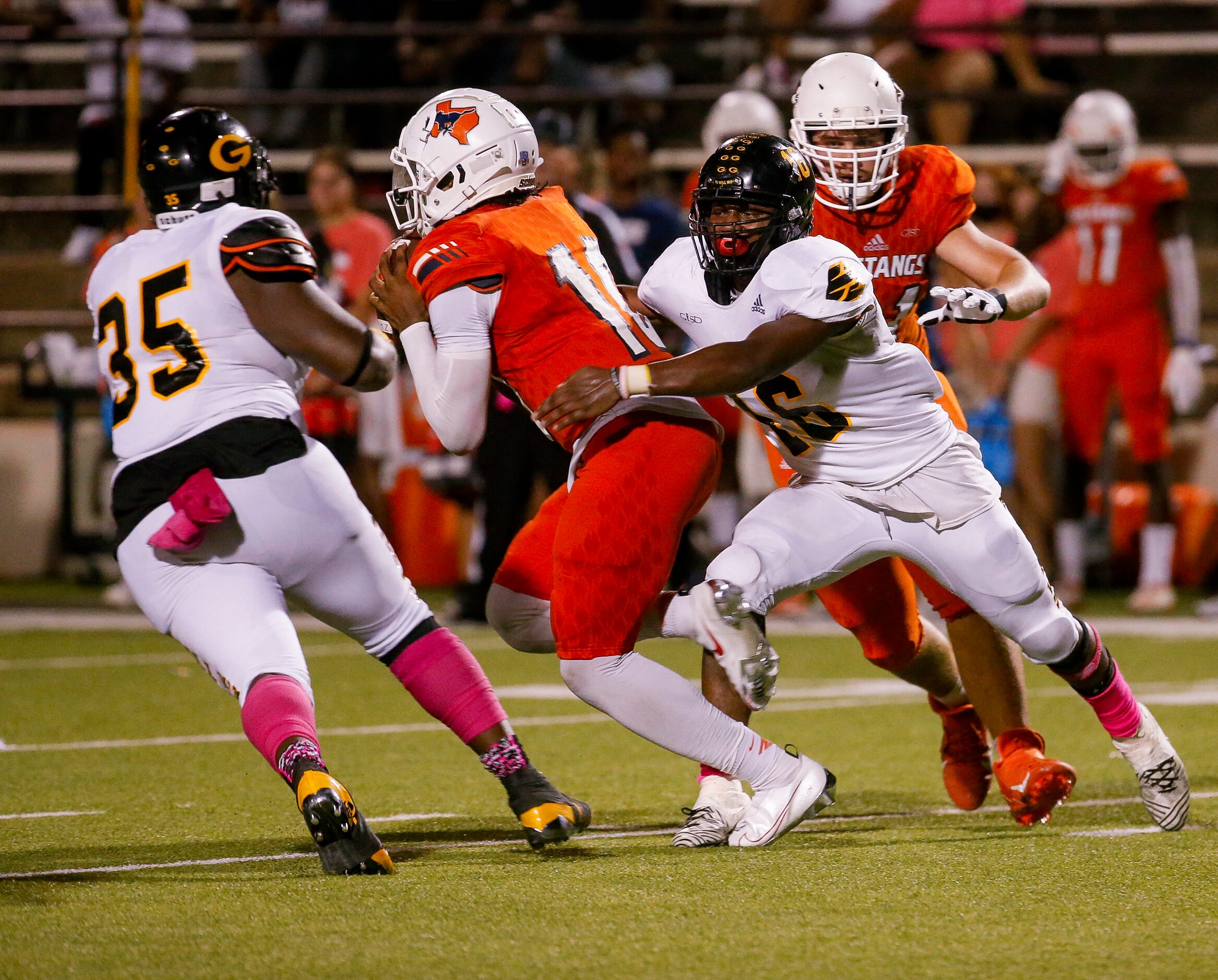 Garland’s DE James Holmes (16) tackles Sachse’s quarterback Alex Orji (10) during the second...