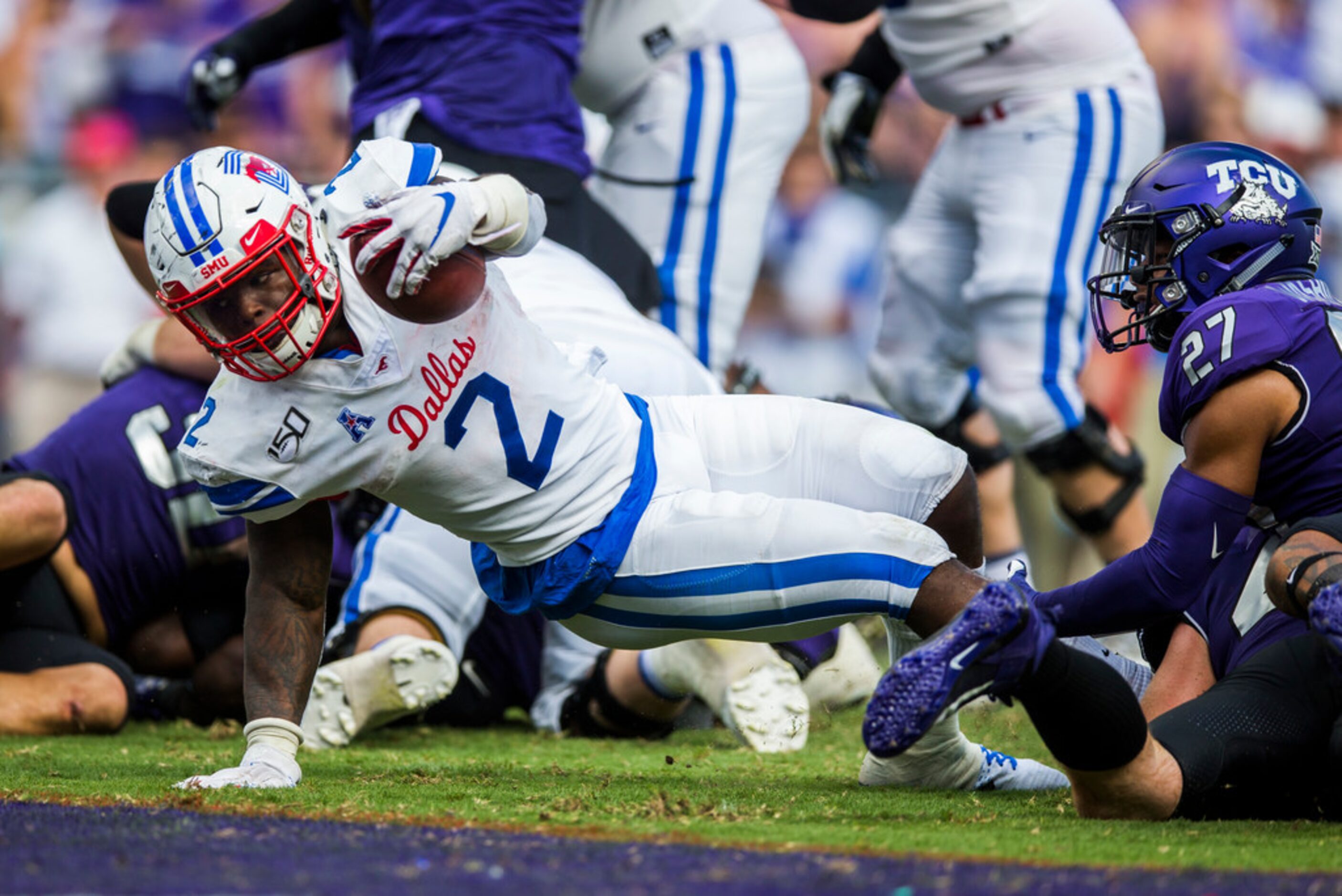 Southern Methodist Mustangs running back Ke'Mon Freeman (2) dives across the goal line for a...