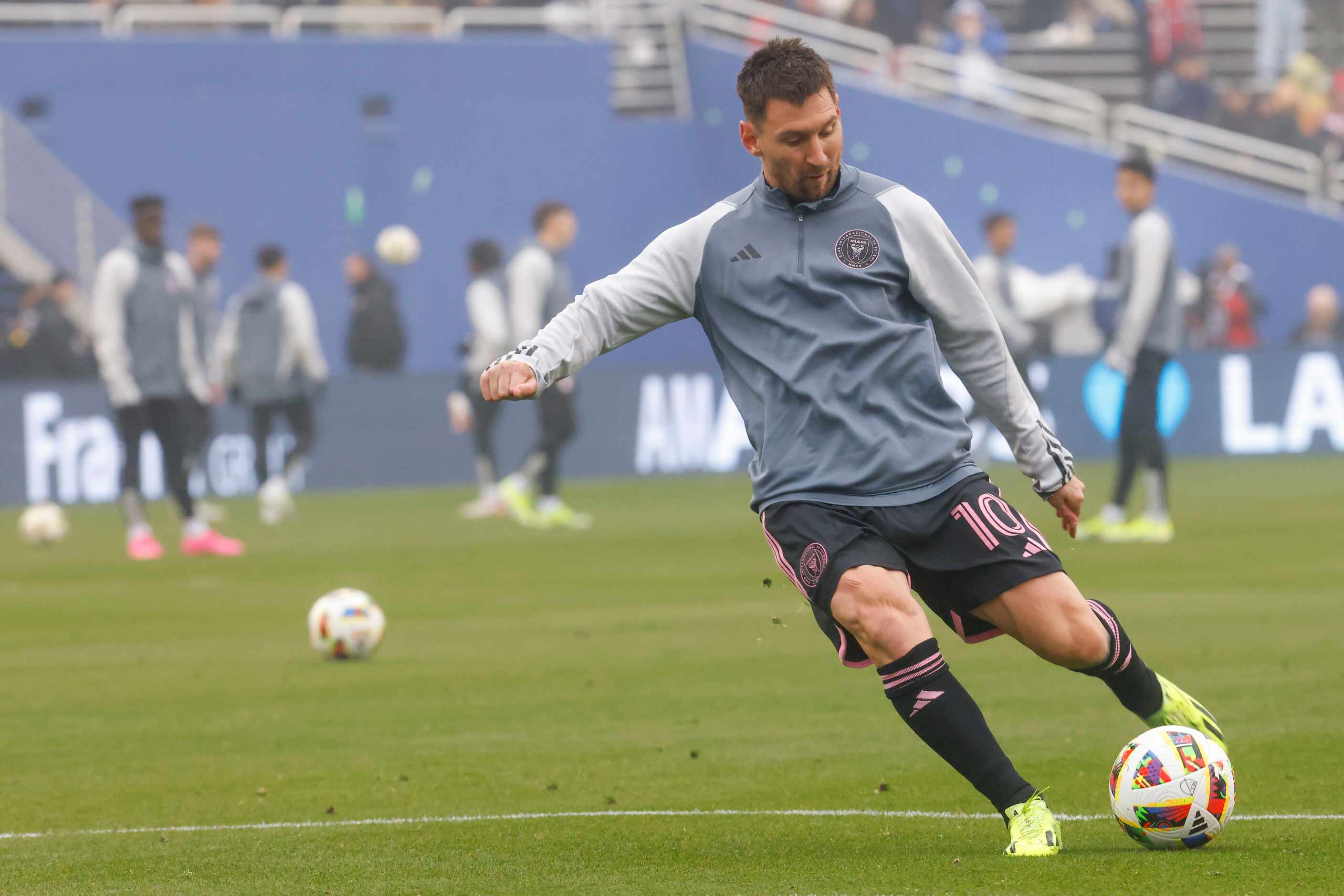 Inter Miami forward Lionel Messi warms up ahead of a preseason friendly soccer game against...