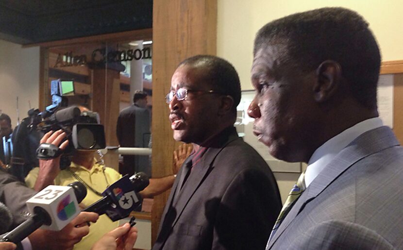 Dr. Christopher Perkins (left), medical director for Dallas County Health and Human...