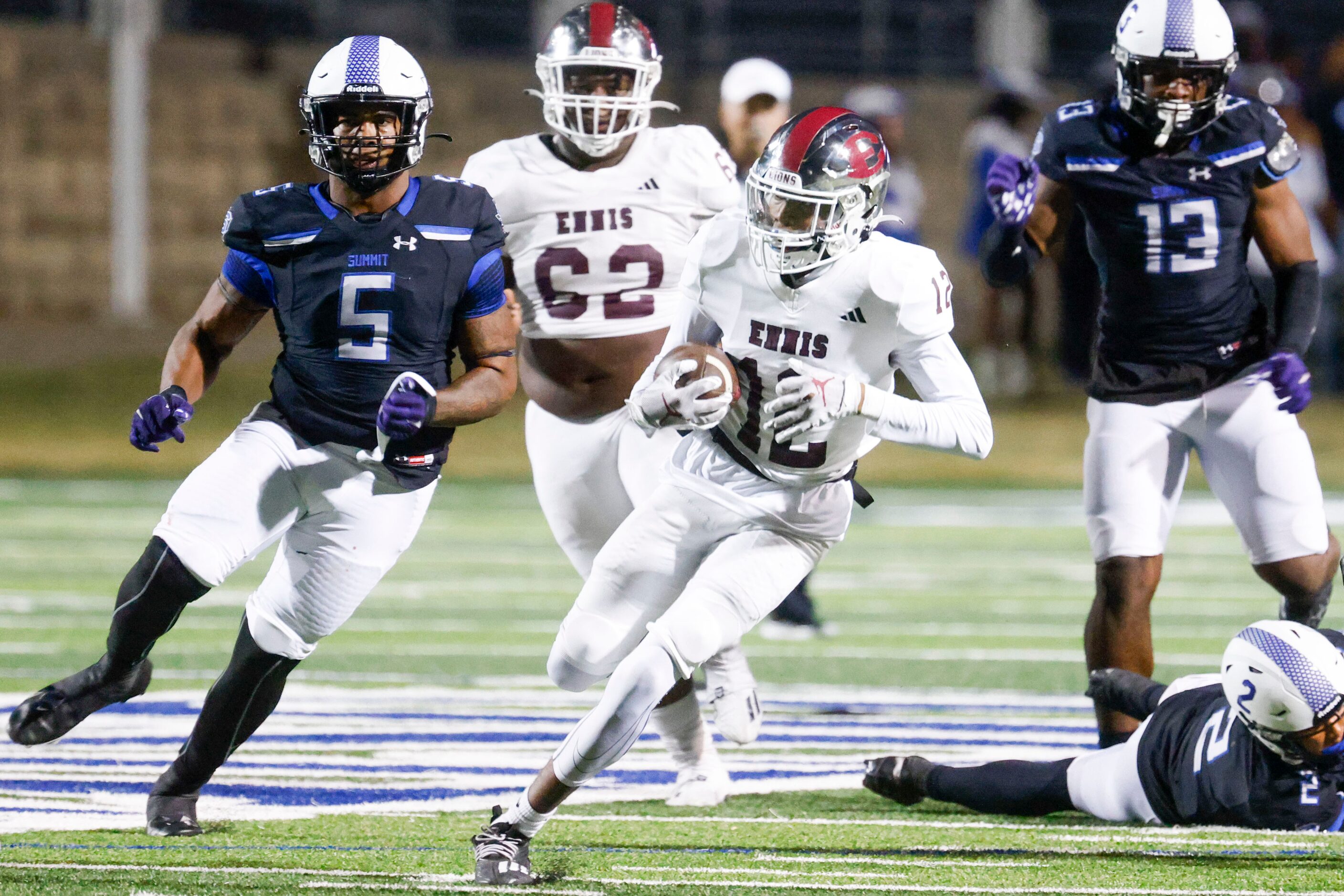 Ennis High’s Taurean Bell (12) runs with the ball against Mansfield Summit High during the...