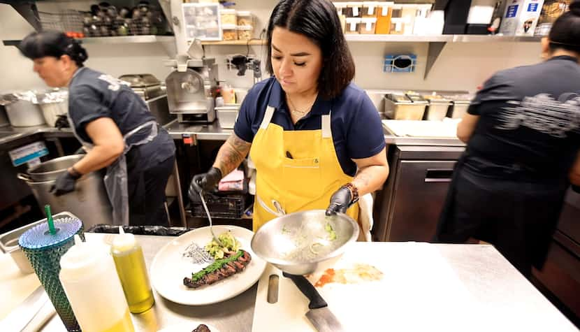 Chef Anastacia Quinoñes Pittman plates a dish of carne asada topped with jalapeno...