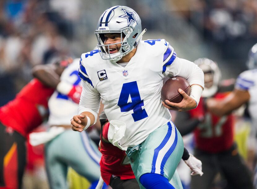 FILE - Cowboys quarterback Dak Prescott (4) runs to the end zone for a touchdown during the...