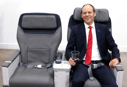 Mark Hiller, CEO and shareholder of Recaro Aircraft Seating, poses in a new aircraft seat...