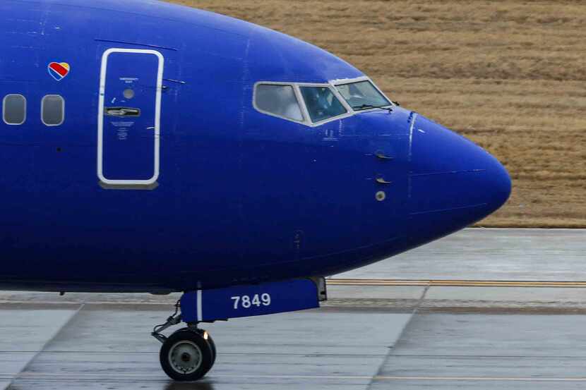 A Southwest Airlines plane gets ready to depart from the Dallas Love Field Airport in Dallas...