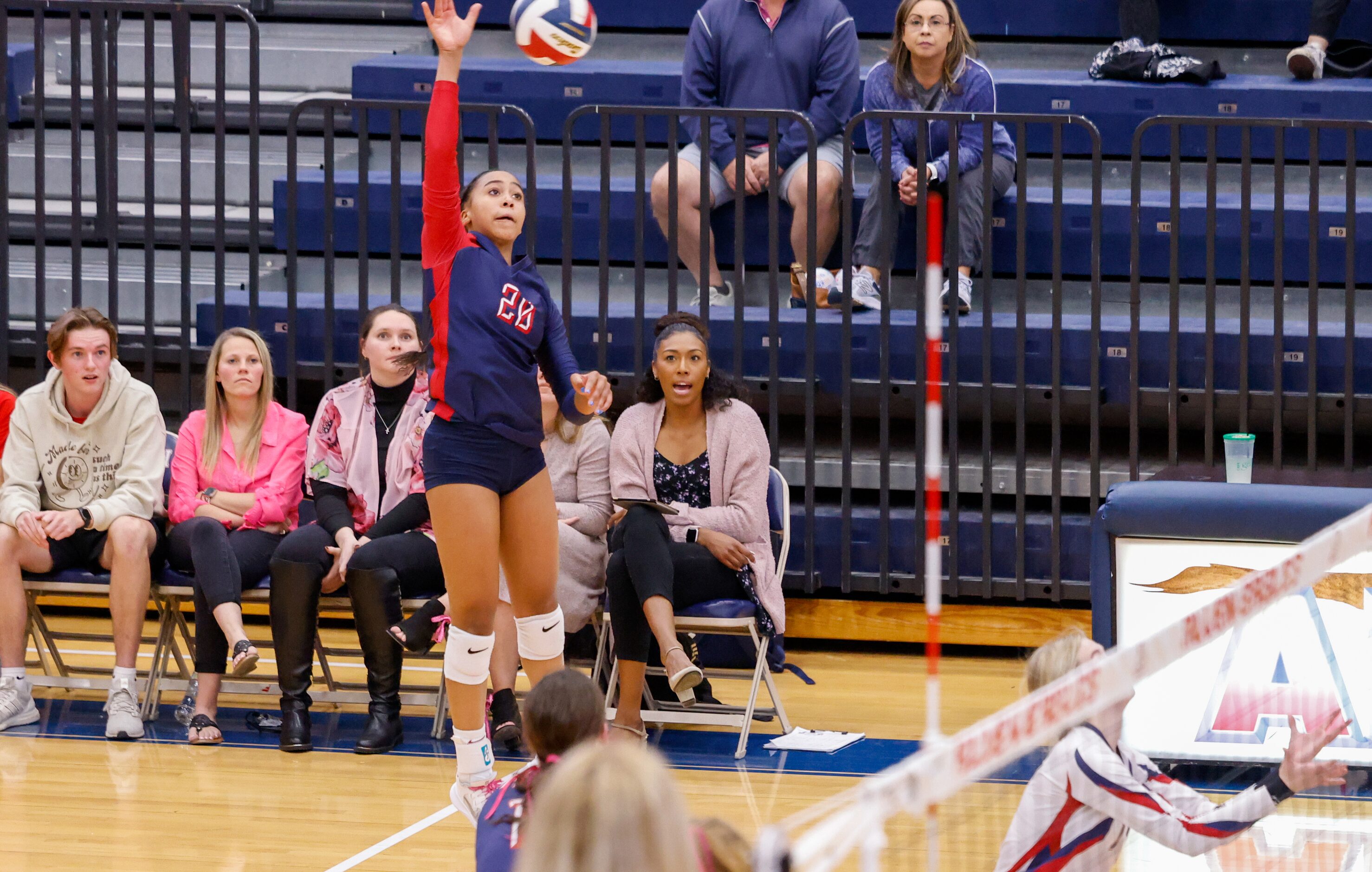 Allen freshman Kennedy Crayton (20) reaches for the ball during the fourth set of a game...