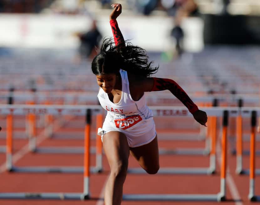 Mesquite Horn's Kaylor Harris (2933) finishes first in the class 6A girls 100-meter hurdles...