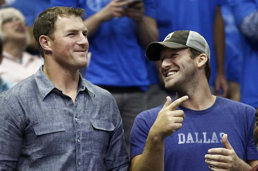 Dallas Cowboys Jason Witten, left, and Tony Romo watched the Dallas Mavericks and San...