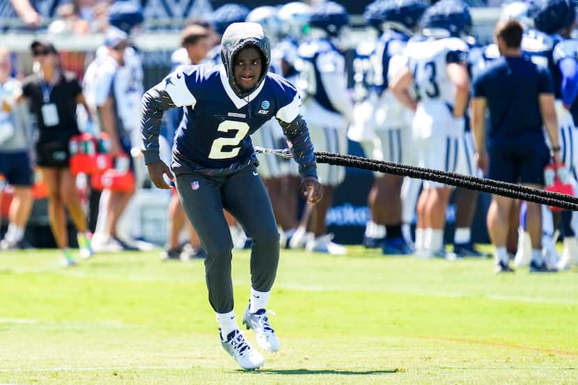 Dallas Cowboys cornerback Jourdan Lewis works on the side with a resistance band during a...